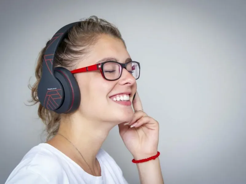 PowerLocus wireless headphones displayed on a desk setup
